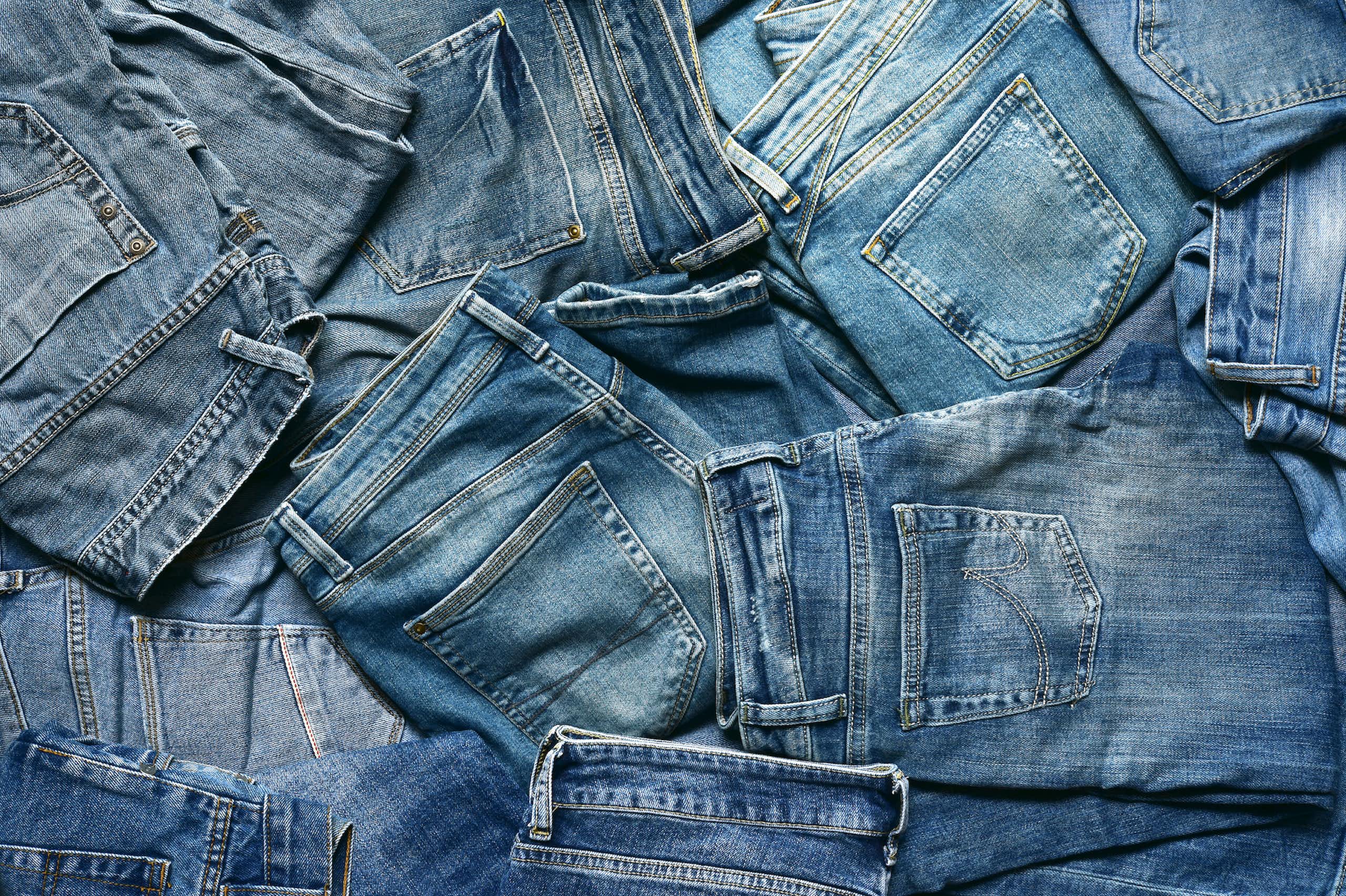 pile of denim jeans