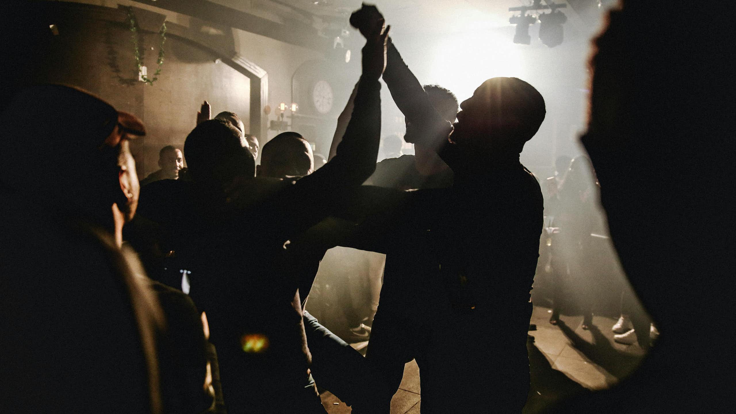 Silhouette of people dancing