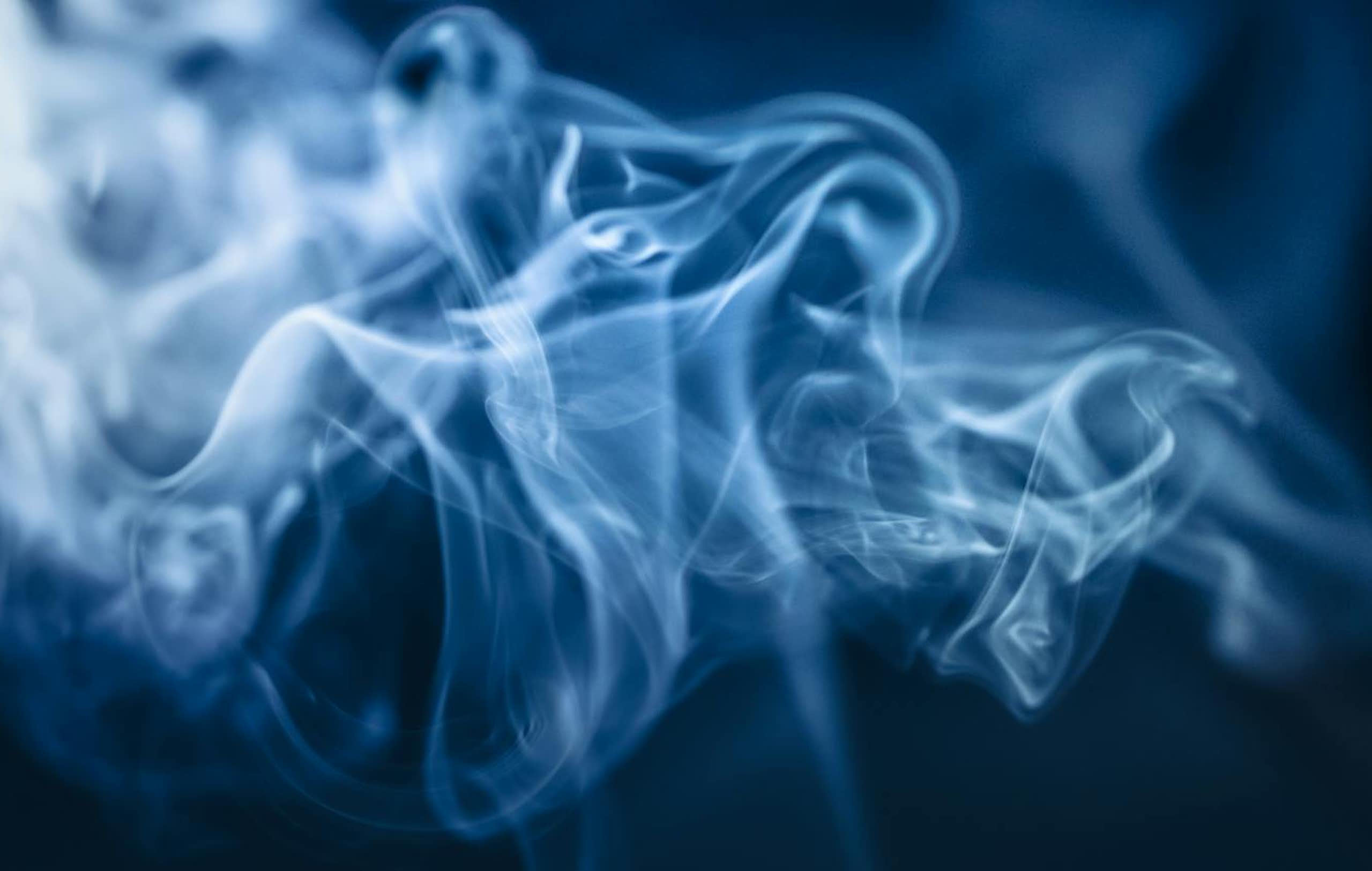 White smoke against dark blue/black background