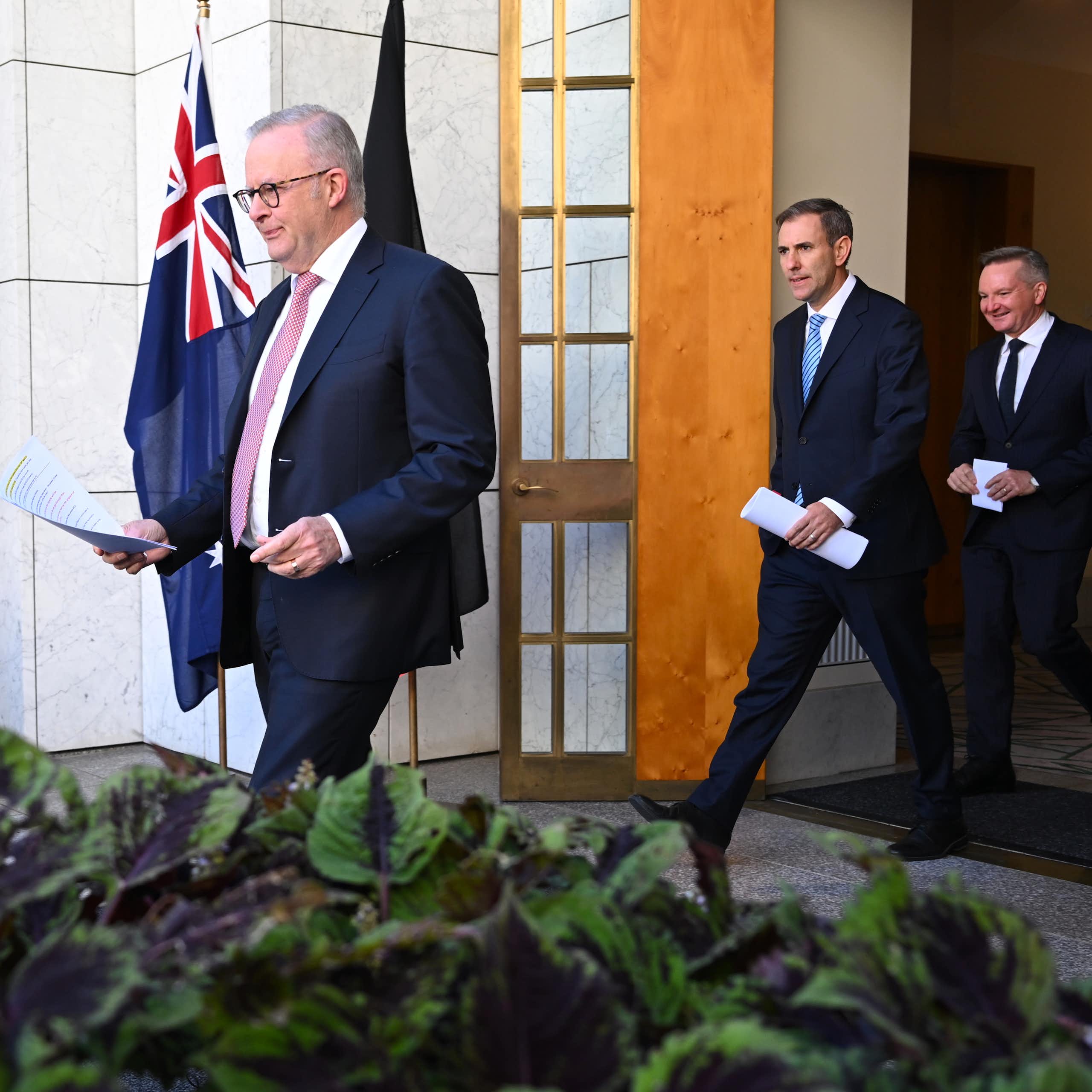 Prime Minister Anthony Albanese,  Treasurer Jim Chalmers and Energy Minister Chris Bowen arrive at Monday's press conference.