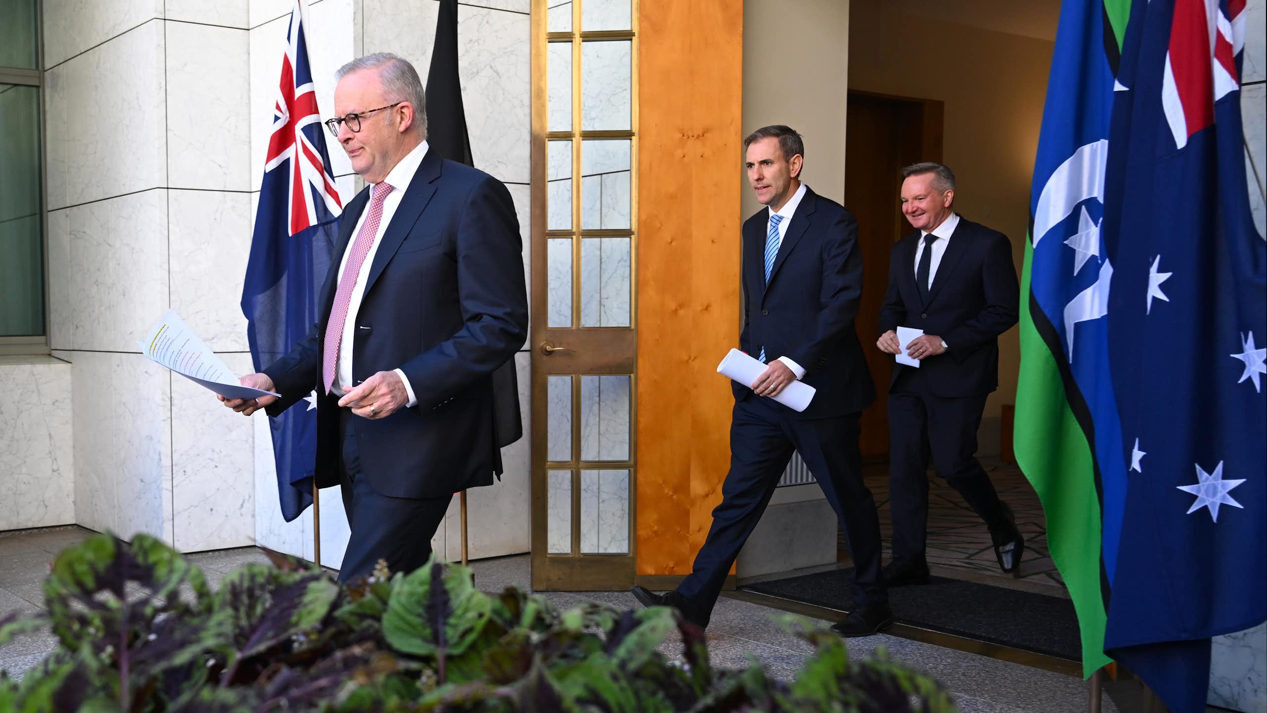 Prime Minister Anthony Albanese,  Treasurer Jim Chalmers and Energy Minister Chris Bowen arrive at Monday's press conference.