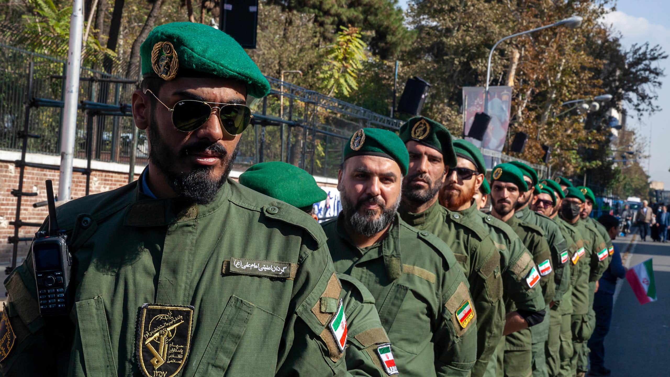 a row of soldiers dressed in green